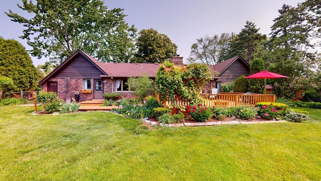 209 Viola Ln, Prospect Heights, IL 60070 - rear view of property featuring a chimney, a deck, a yard, and brick siding