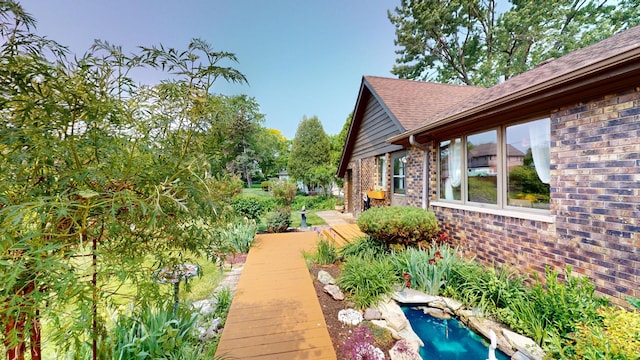 209 Viola Ln, Prospect Heights, IL 60070 - view of property exterior with brick siding and a shingled roof