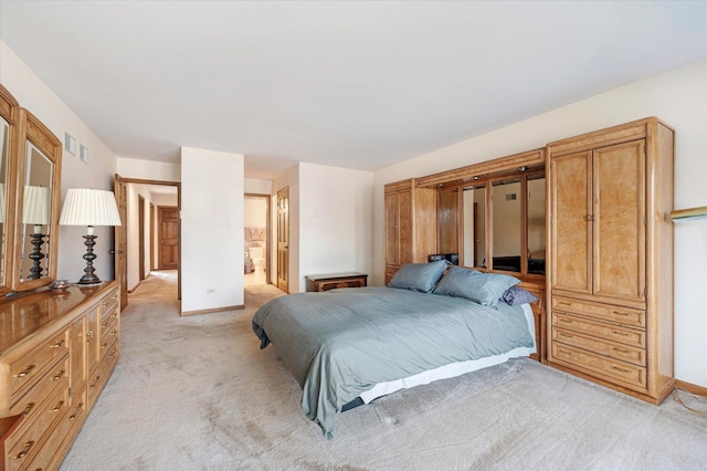 1144 W Trinity Dr, Addison, IL 60101 - bedroom with light carpet and connected bathroom