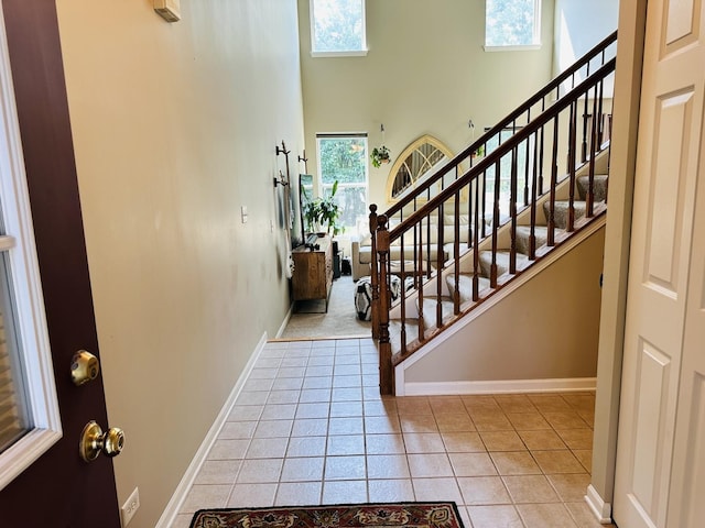 963 Oak Ridge Blvd, Elgin, IL 60120 - foyer with stairway, light tile patterned floors, and a high ceiling
