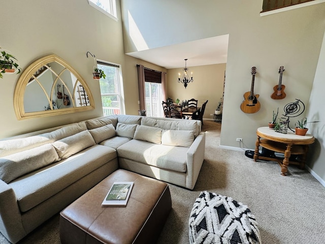 963 Oak Ridge Blvd, Elgin, IL 60120 - carpeted living area featuring a chandelier, plenty of natural light, and a high ceiling