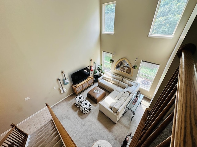 963 Oak Ridge Blvd, Elgin, IL 60120 - carpeted living area with a towering ceiling and tile patterned flooring