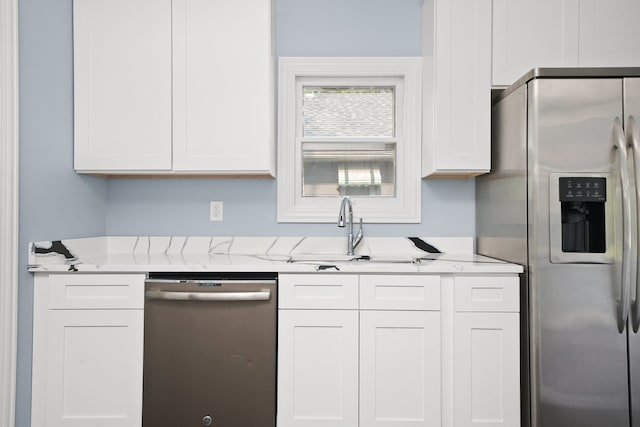 306 Barry Ave, Lockport, IL 60441 - kitchen featuring appliances with stainless steel finishes, a sink, and white cabinetry