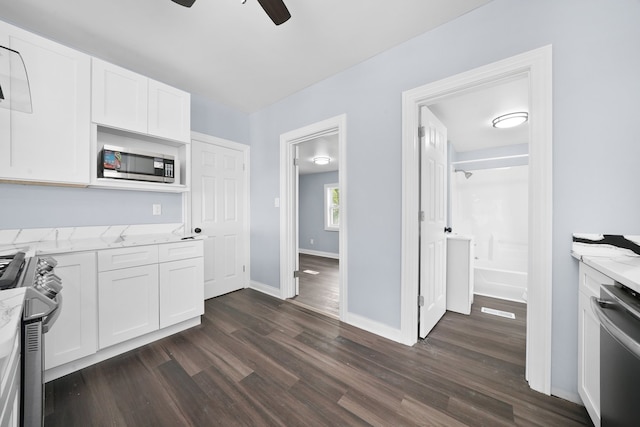 306 Barry Ave, Lockport, IL 60441 - kitchen featuring appliances with stainless steel finishes, ceiling fan, light stone countertops, and dark wood finished floors