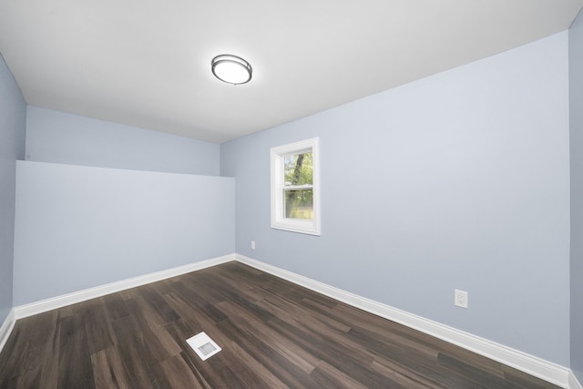306 Barry Ave, Lockport, IL 60441 - spare room featuring baseboards and dark wood-type flooring