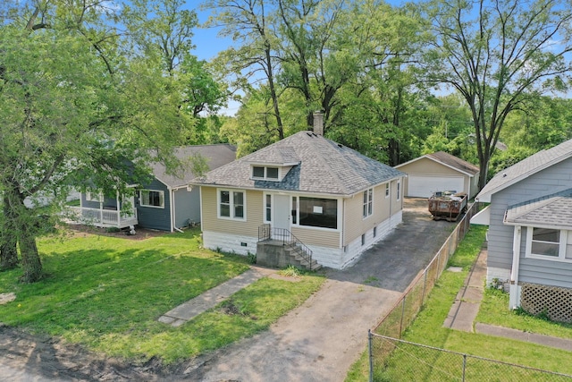 306 Barry Ave, Lockport, IL 60441 - view of front of home with a detached garage, an outdoor structure, a chimney, and a shingled roof