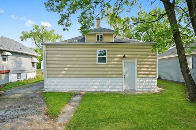 306 Barry Ave, Lockport, IL 60441 - back of property with a chimney, a yard, and a shingled roof