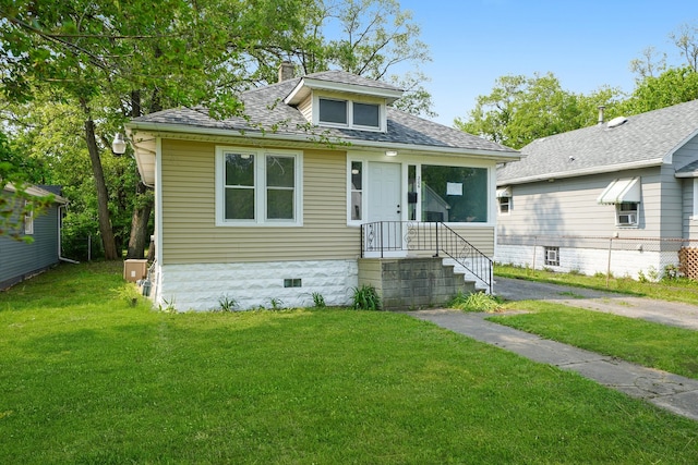 306 Barry Ave, Lockport, IL 60441 - bungalow featuring a front yard, a chimney, and a shingled roof