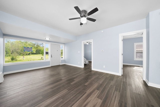 306 Barry Ave, Lockport, IL 60441 - unfurnished living room with a ceiling fan, baseboards, and dark wood-style flooring