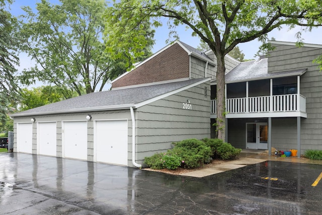 2051 Creekside Dr Unit 2-2, Wheaton, IL 60189 - view of home's exterior with roof with shingles, french doors, and a balcony