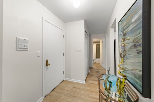2051 Creekside Dr Unit 2-2, Wheaton, IL 60189 - hallway featuring light wood finished floors and baseboards