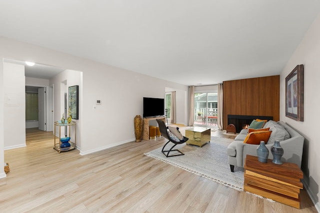 2051 Creekside Dr Unit 2-2, Wheaton, IL 60189 - living room with light wood-style floors and baseboards