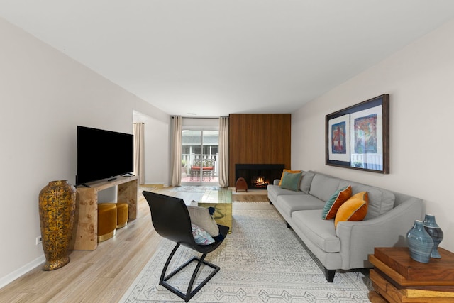 2051 Creekside Dr Unit 2-2, Wheaton, IL 60189 - living room featuring light wood finished floors, a fireplace, and baseboards