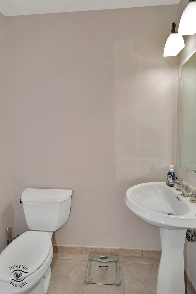 1205 Jennie Dr, New Lenox, IL 60451 - bathroom with toilet, baseboards, and tile patterned floors