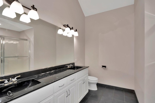 1205 Jennie Dr, New Lenox, IL 60451 - full bath with double vanity, toilet, an enclosed shower, vaulted ceiling, and tile patterned floors