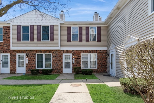 410 Kensington Ct Unit 410, Naperville, IL 60563 - multi unit property with brick siding, a front yard, and a chimney
