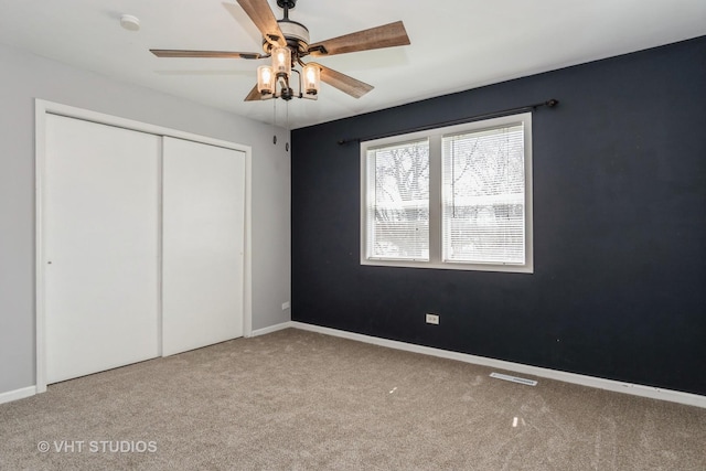 410 Kensington Ct Unit 410, Naperville, IL 60563 - unfurnished bedroom featuring carpet flooring, a closet, baseboards, and ceiling fan