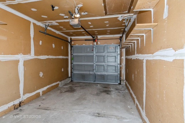 410 Kensington Ct Unit 410, Naperville, IL 60563 - garage featuring a garage door opener