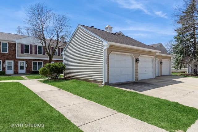 410 Kensington Ct Unit 410, Naperville, IL 60563 - view of home's exterior with a lawn, driveway, a garage, a shingled roof, and a chimney