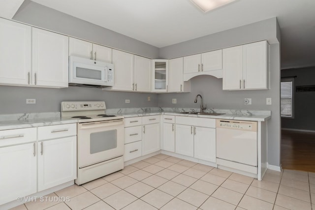 410 Kensington Ct Unit 410, Naperville, IL 60563 - kitchen with white appliances, a sink, white cabinets, and light tile patterned floors