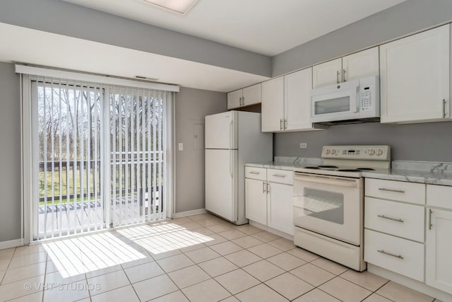 410 Kensington Ct Unit 410, Naperville, IL 60563 - kitchen featuring white appliances, plenty of natural light, white cabinets, and light tile patterned flooring