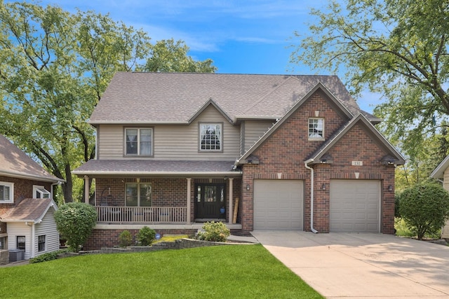 131 N Wilmette Ave, Westmont, IL 60559 - view of front of property featuring driveway, covered porch, a front lawn, brick siding, and a garage