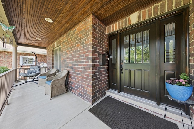 131 N Wilmette Ave, Westmont, IL 60559 - doorway to property with a porch and brick siding