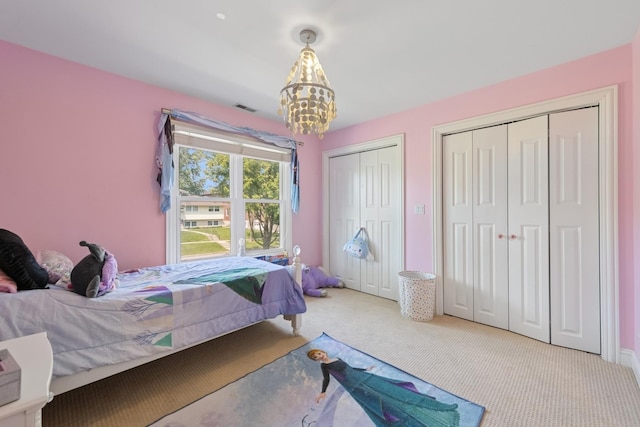 131 N Wilmette Ave, Westmont, IL 60559 - carpeted bedroom with multiple closets and a chandelier