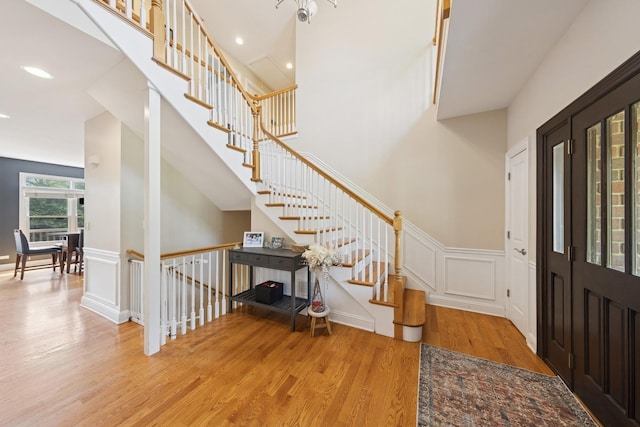 131 N Wilmette Ave, Westmont, IL 60559 - foyer with wood finished floors, wainscoting, a decorative wall, recessed lighting, and stairs
