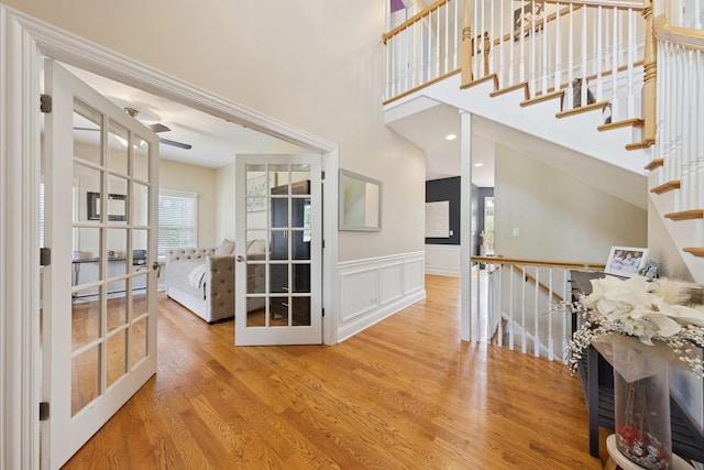 131 N Wilmette Ave, Westmont, IL 60559 - entryway featuring french doors, wood finished floors, wainscoting, and a decorative wall
