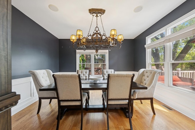 131 N Wilmette Ave, Westmont, IL 60559 - dining space with a chandelier, healthy amount of natural light, wood finished floors, and a wainscoted wall