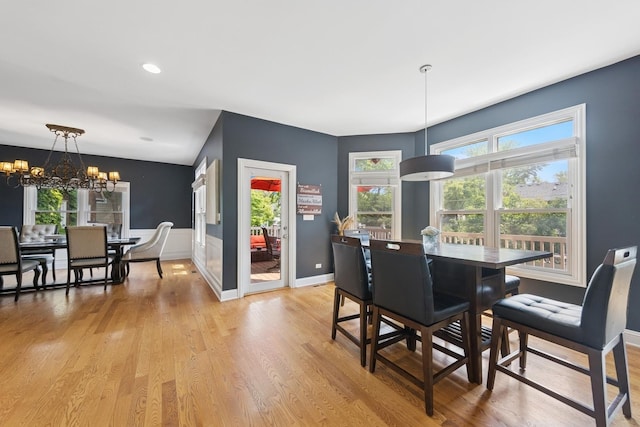 131 N Wilmette Ave, Westmont, IL 60559 - dining area featuring a chandelier, light wood-type flooring, and baseboards