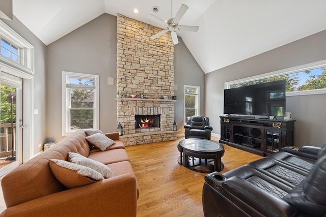 131 N Wilmette Ave, Westmont, IL 60559 - living area featuring high vaulted ceiling, ceiling fan, plenty of natural light, wood finished floors, and a stone fireplace