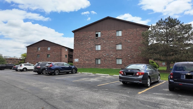 15711 Peggy Ln Unit 7, Oak Forest, IL 60452 - view of building exterior featuring uncovered parking