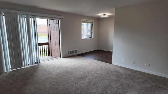 15711 Peggy Ln Unit 7, Oak Forest, IL 60452 - spare room with dark colored carpet and baseboards