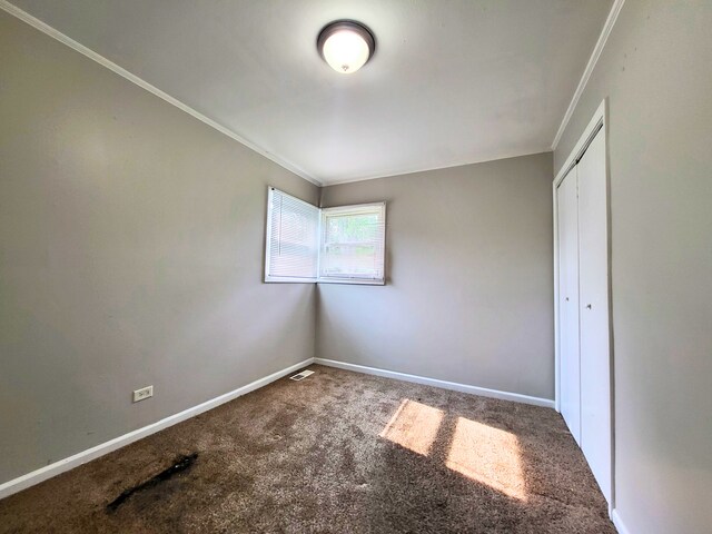 304 Shawnee St, Park Forest, IL 60466 - unfurnished bedroom featuring ornamental molding, carpet, and a closet