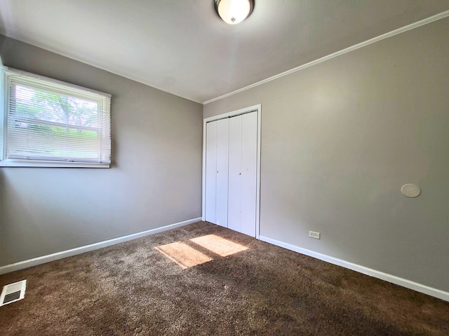 304 Shawnee St, Park Forest, IL 60466 - unfurnished bedroom with carpet flooring, a closet, and ornamental molding