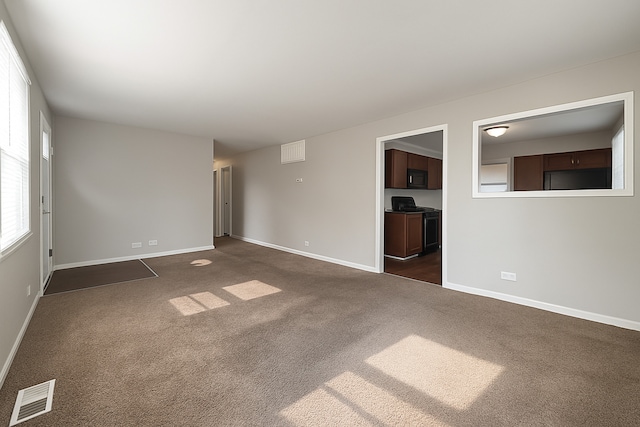 304 Shawnee St, Park Forest, IL 60466 - empty room with dark carpet and baseboards