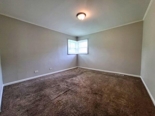 304 Shawnee St, Park Forest, IL 60466 - carpeted empty room featuring crown molding and baseboards