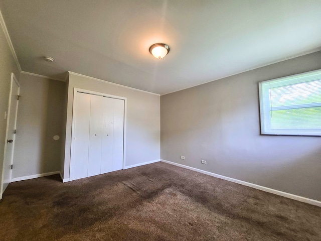 304 Shawnee St, Park Forest, IL 60466 - unfurnished bedroom with dark carpet, crown molding, and a closet