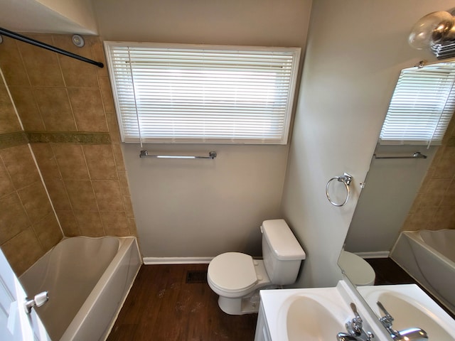 304 Shawnee St, Park Forest, IL 60466 - full bath featuring vanity, wood finished floors, shower / tub combination, and plenty of natural light