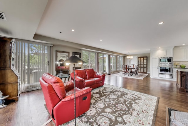 2050 Arbor Ln Unit 301, Northfield, IL 60093 - living area with a chandelier, wood finished floors, and recessed lighting