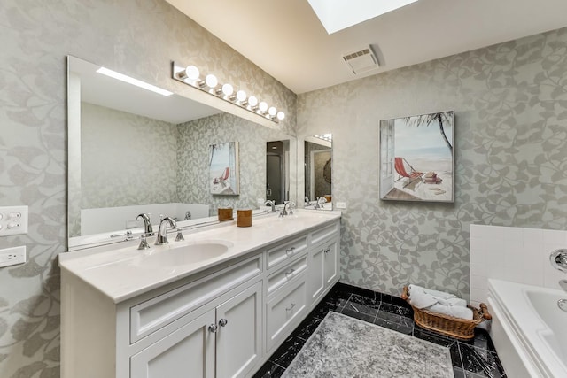 2050 Arbor Ln Unit 301, Northfield, IL 60093 - full bath featuring double vanity, a garden tub, wallpapered walls, a skylight, and marble finish flooring