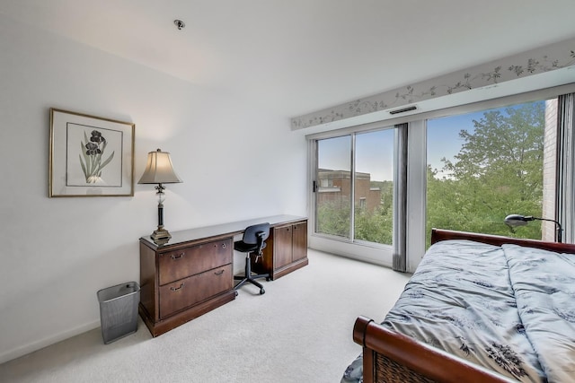 2050 Arbor Ln Unit 301, Northfield, IL 60093 - bedroom featuring light colored carpet, multiple windows, an office area, and access to exterior