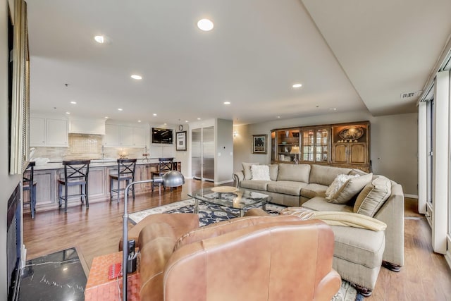 2050 Arbor Ln Unit 301, Northfield, IL 60093 - living area featuring light wood-type flooring and recessed lighting