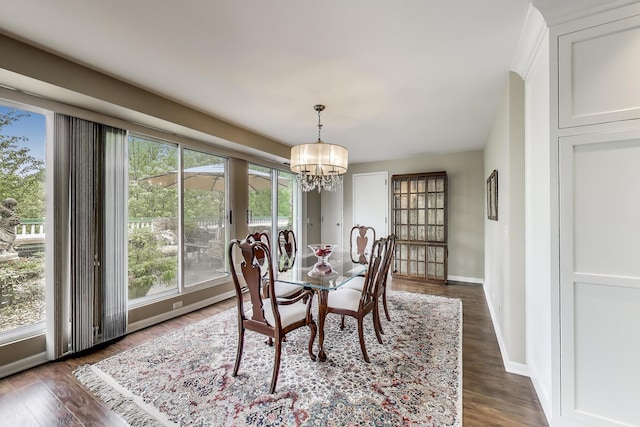 2050 Arbor Ln Unit 301, Northfield, IL 60093 - dining area featuring a chandelier and dark wood-style flooring