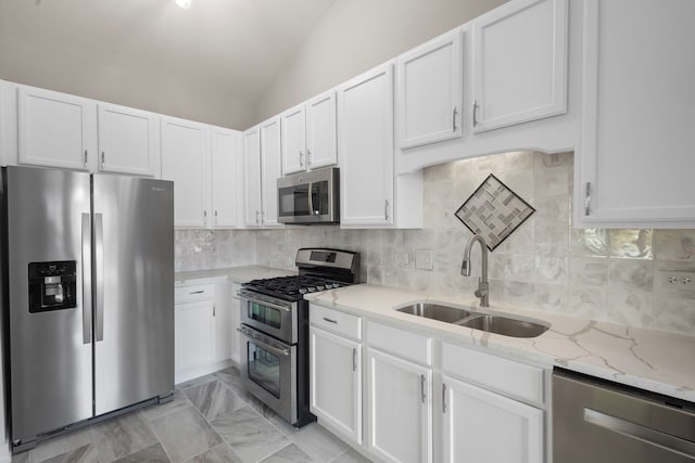 1944 Sundrop Ct Unit 0, Bartlett, IL 60103 - kitchen with appliances with stainless steel finishes, a sink, white cabinetry, light stone countertops, and vaulted ceiling