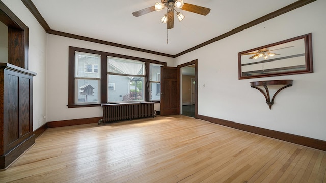 110 E Center St, Mount Morris, IL 61054 - empty room featuring radiator heating unit, light wood-style flooring, crown molding, ceiling fan, and baseboards