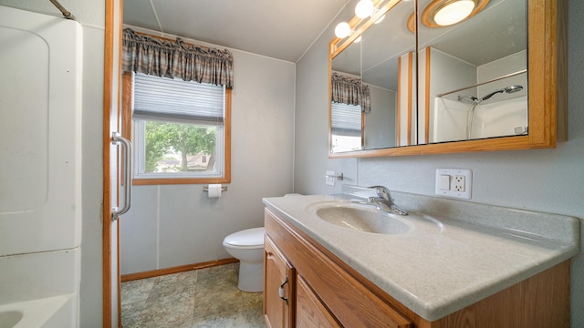 110 E Center St, Mount Morris, IL 61054 - bathroom featuring vanity, baseboards, toilet, and stone finish floors