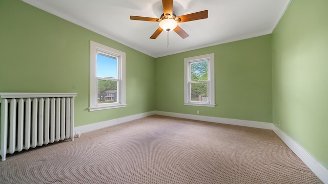 110 E Center St, Mount Morris, IL 61054 - unfurnished room featuring radiator heating unit, baseboards, carpet, a ceiling fan, and ornamental molding